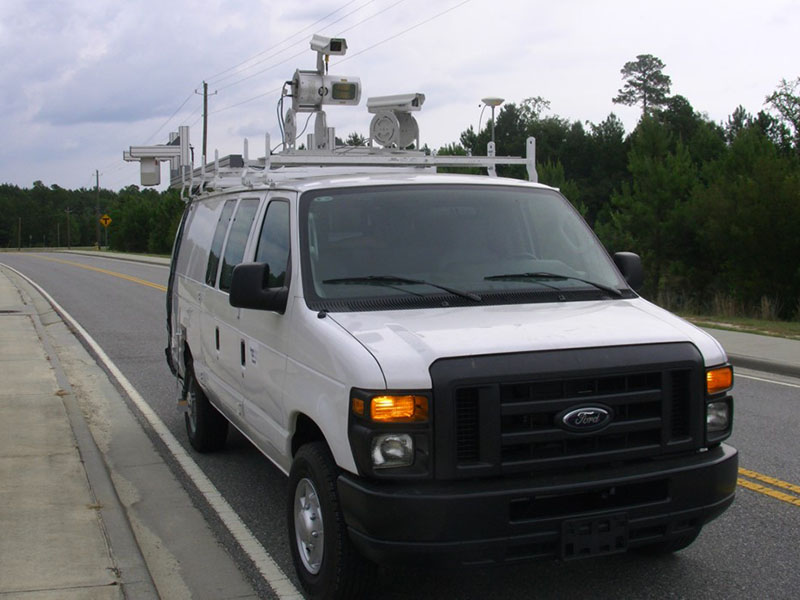 An image of a van with remote sensing equipment on the roof.